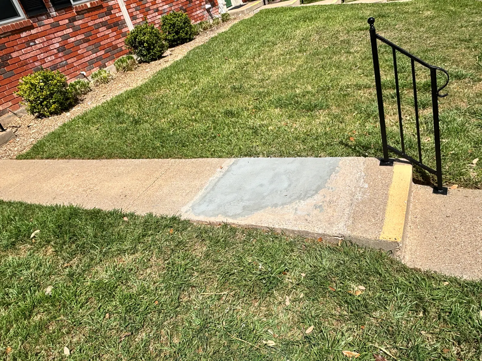 Trip hazard removed with a simple patch near a residential walkway
